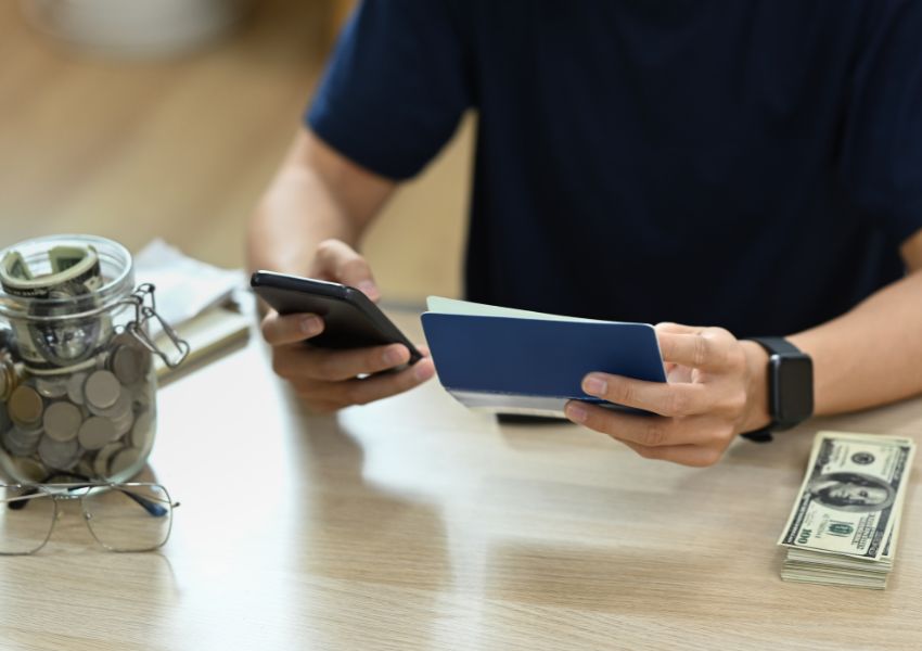 person-with-pen-phone-and-cash