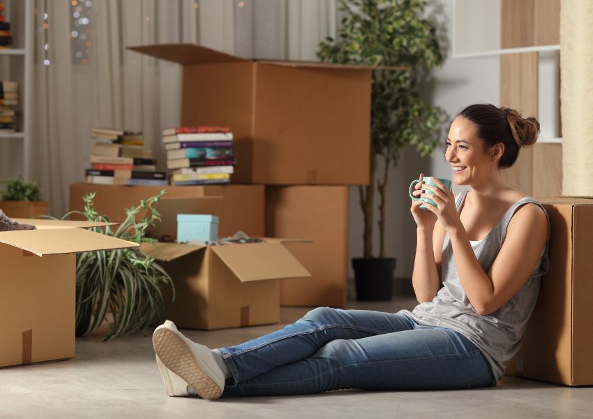 person-leaning-against-box-with-cup